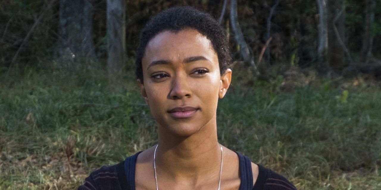Sasha Williams sitting in the forest in The Walking Dead 